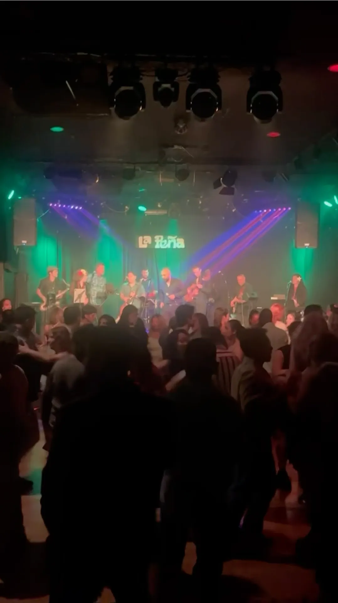 Guajirón performing at La Peña with dancers in front of the stage