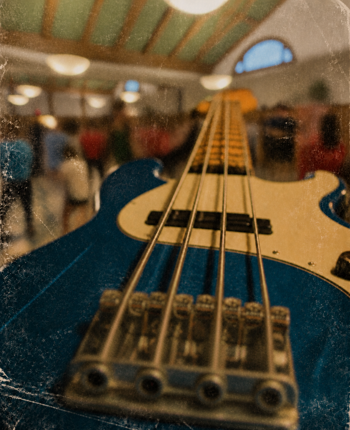 Close-up of a blue electric bass at a rehearsal